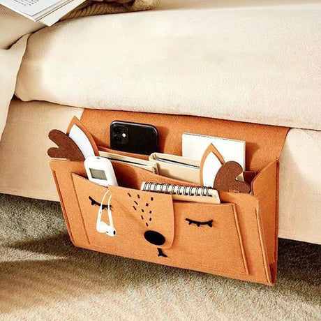 Felt bedside storage bag with cute animal design, perfect for dorms, holds gadgets, books, and more. Shopway product.