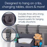 Grey baby crib bedside storage bag with buckle straps, designed for hanging, showcasing pockets filled with baby essentials. Shopway.