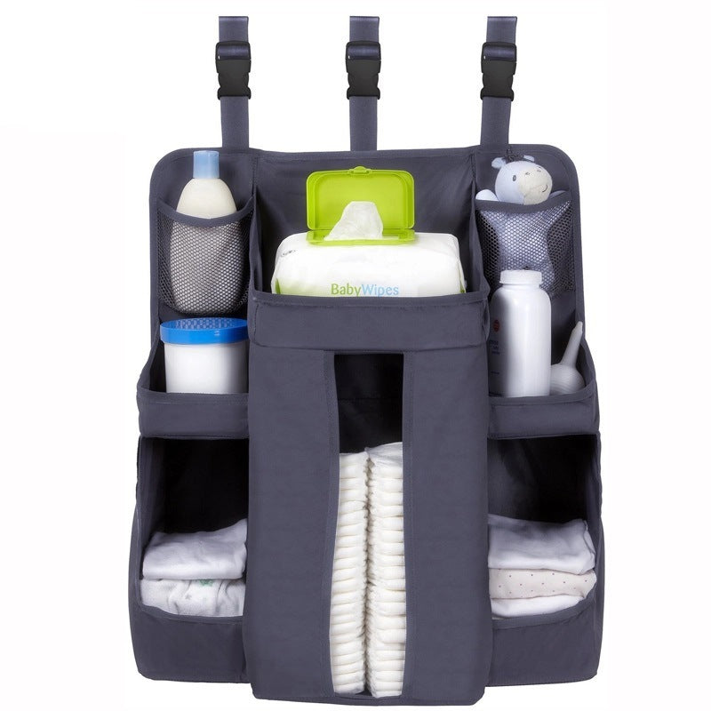 Grey oxford cloth baby crib bedside storage bag with multiple pockets for diapers, wipes, and baby essentials by Shopway.