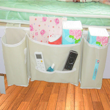 Japanese-style hanging bedside storage bag in beige, holding books, remotes, and toiletries. Ideal for bedroom or multi-use, by Shopway.
