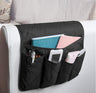Black sofa side armrest storage bag with pockets for remote and books, perfect for living room organization. Shopway product.