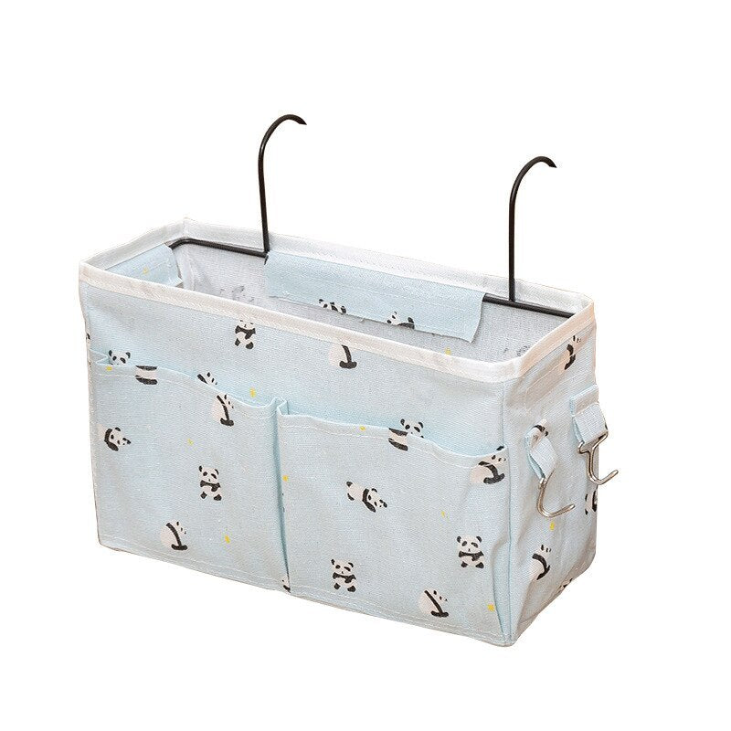 Shopway bedside storage bag with multiple pockets, sturdy canvas, and metal hooks for holding books, phone, and snacks.