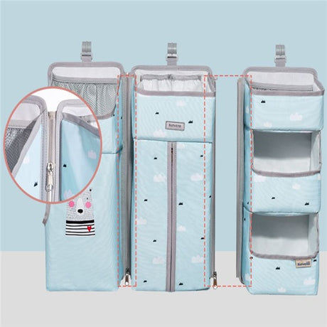 Blue multifunctional bedside hanging storage bag for diapers with zip detail, ideal for newborns. Available on Shopway.