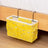 Yellow canvas bedside storage bag with multiple pockets and metal hooks, ideal for organizing books and gadgets. Available at Shopway.