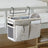 Canvas bedside storage basket with wrought iron bracket hanging on bed, holding phone, books, and glasses. Shopway product for dorm room.