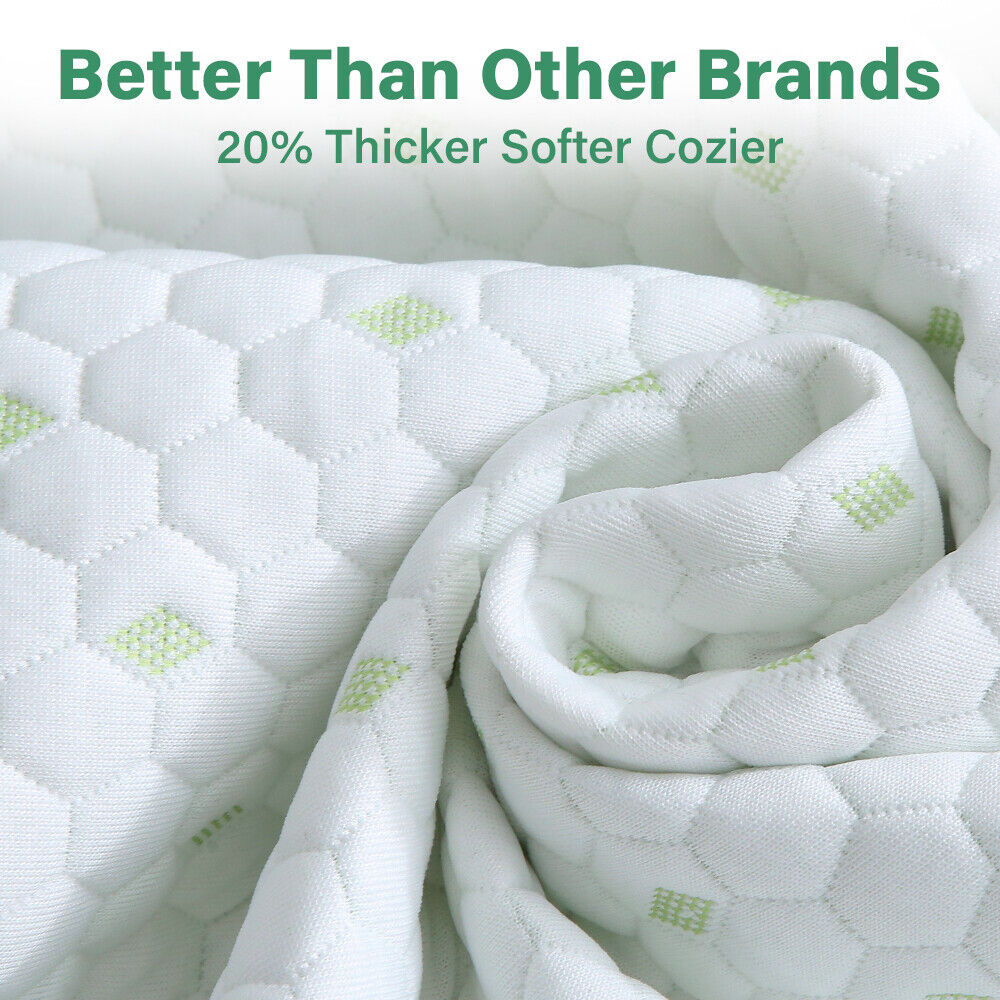 Close-up of Shopway's bamboo cotton mattress protector, showing its thick, soft fabric with hexagonal pattern and green highlights.