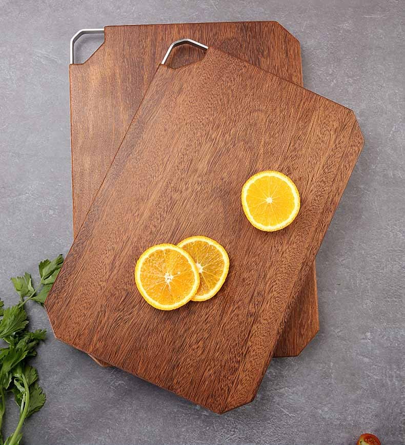 Octagonal wooden chopping board with sliced oranges, featuring a durable Shopway design resistant to mold and deformation.