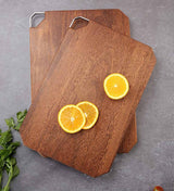 Octagonal wooden chopping board with sliced oranges, featuring a durable Shopway design resistant to mold and deformation.